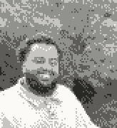 Dithered portrait of Yahya smiling outdoors
